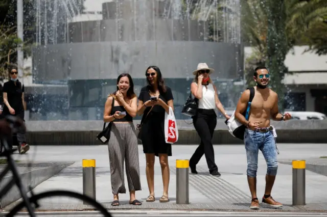 People walk along the street in Israel