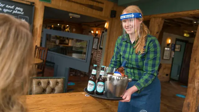 Bar worker wearing a visor