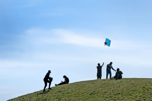 Kite flyers on a hill at Northala Fields in west London