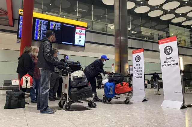 People wait to be tested at Heathrow