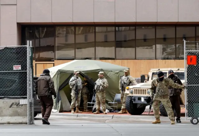 National Guard soldiers stand outside Hennepin County Government Center