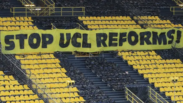 A banner against Champions Leahue reforms was in the stands of Borussia Dortmund's stadium during their Champions League quarter-final against Manchester City