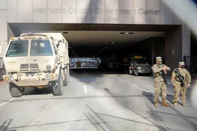 National Guard soldiers stand outside Hennepin County Government Center