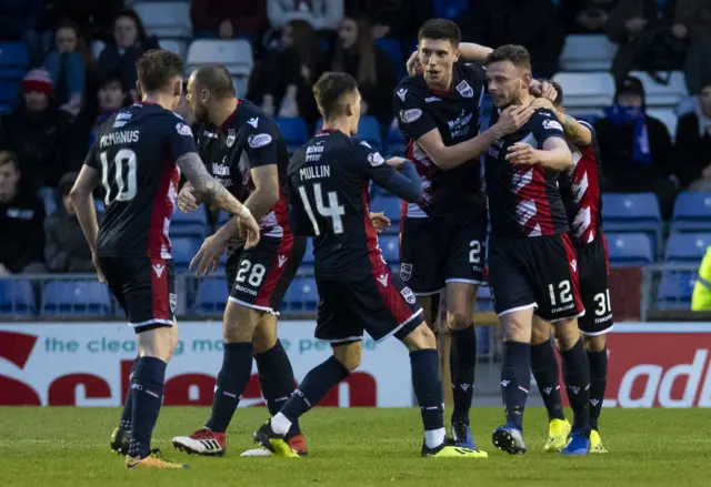 The Ross County players celebrate Andrew Boyle’s (right) goal to make it 2-1