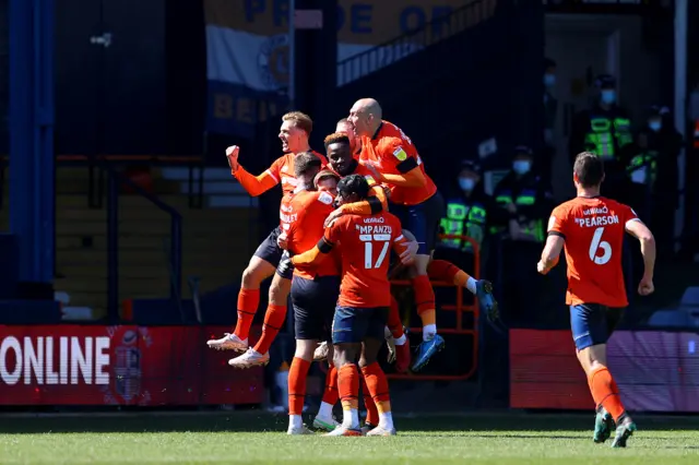 Luton celebrate James Collins' penalty versus Watford