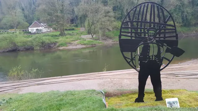 The sculpture of coracle man Tommy Rogers in Ironbridge