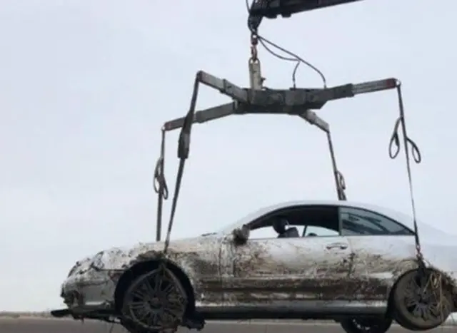 Car lifted from ditch