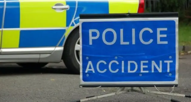 Police car and accident sign