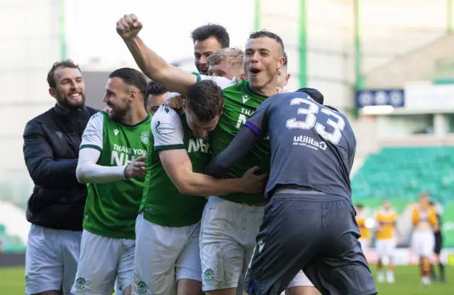 Ryan Porteous celebrates after tucking away the decisive penalty kick