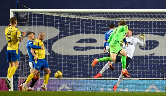 St Johnstone's Zander Clark heads towards goal