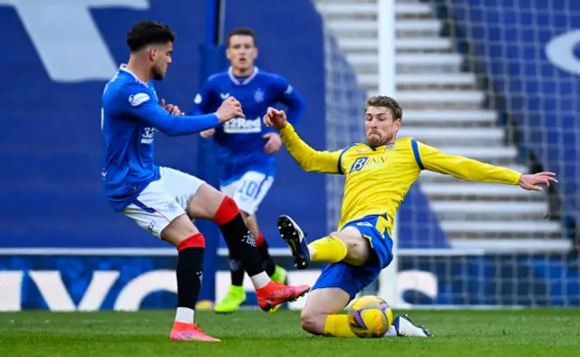 St Johnstone's David Wotherspoon tackles Rangers' Ianis Hagi