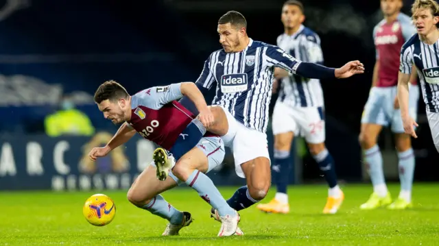 John McGinn tackled by Jake Livermore