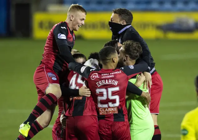 St Mirren players celebrate Kyle McAllister's winning penalty