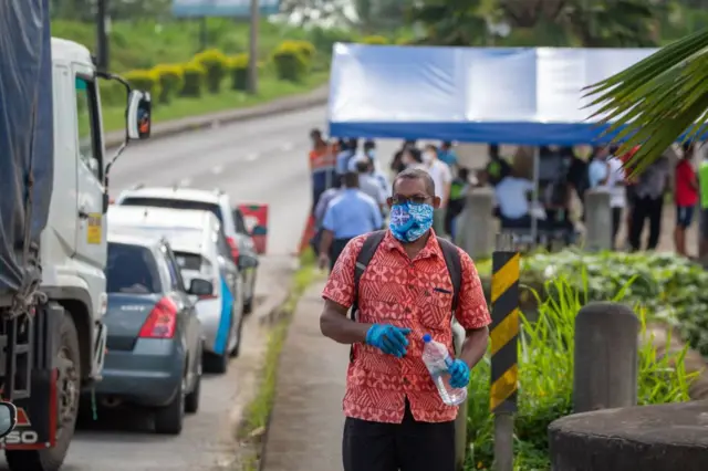 Man wears mask in Fiji