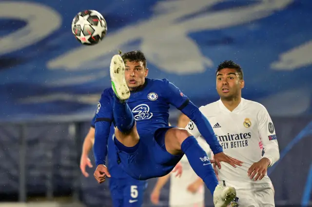 Chelsea's Brazilian defender Thiago Silva (L) jumps for the ball next to Real Madrid's Brazilian midfielder Casemiro during the UEFA Champions League semi-final first leg football match between Real Madrid and Chelsea at the Alfredo di Stefano stadium