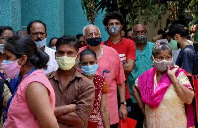 People in Mumbai waiting to receive a vaccine