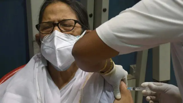 Woman receiving vaccine