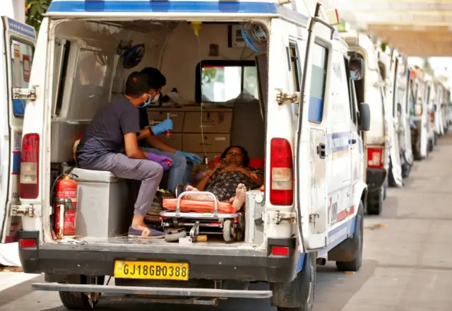 A woman waiting in an ambulance for treatment at a hospital