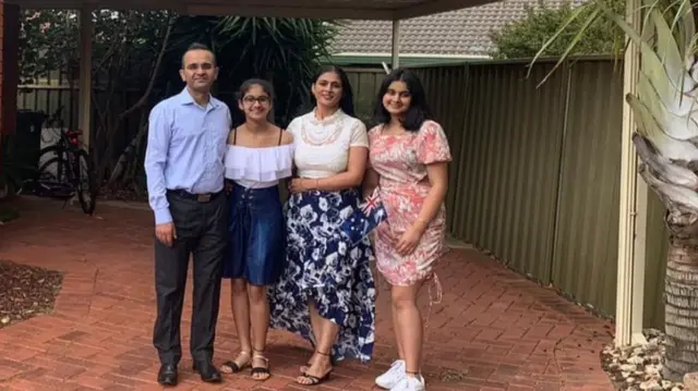 Mandeep Sharma (left) and his family in Australia