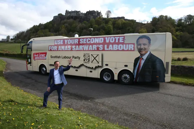 Anas Sarwar unveils the Scottish Labour bus in front of Stirling Castle