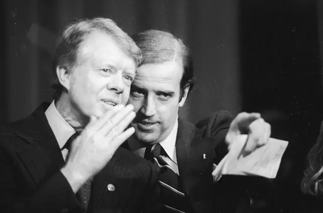 Senator Joe Biden speaks to President Jimmy Carter