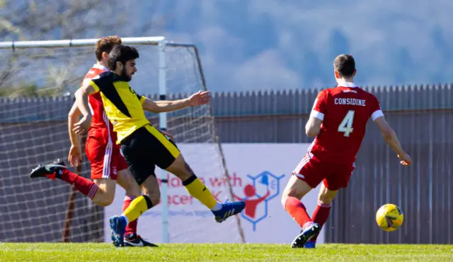 Dumbarton's Rabin Omar shoots