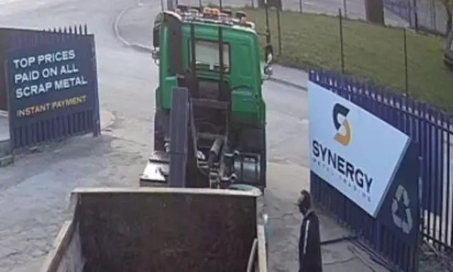 CCTV image of lorry and skip