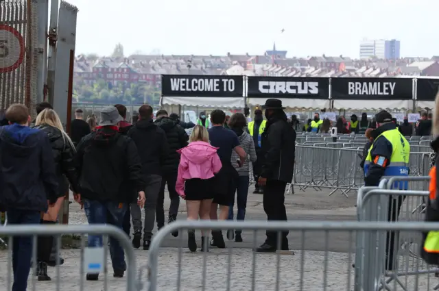 Revellers arrive at Circus nightclub in Bramley-Moore Dock, Liverpool, for a Covid safety pilot event which will be attended by around 3000 people