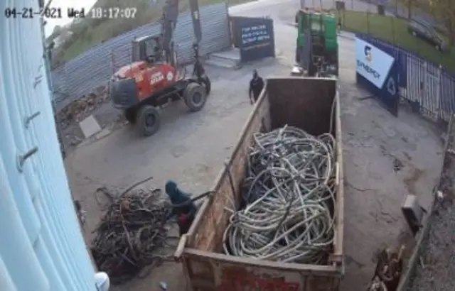 CCTV image of lorry and skip