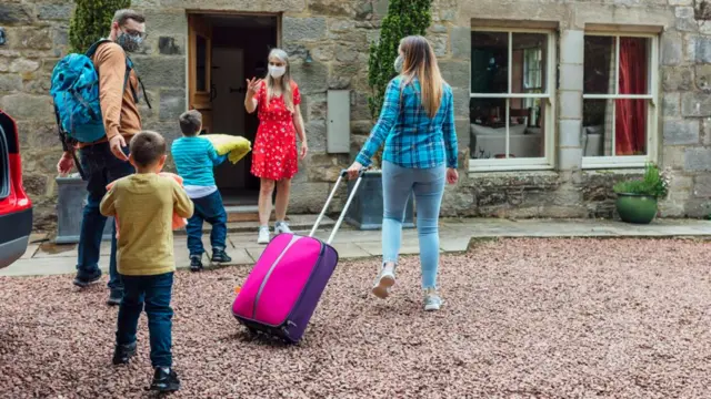 A family with suitcases