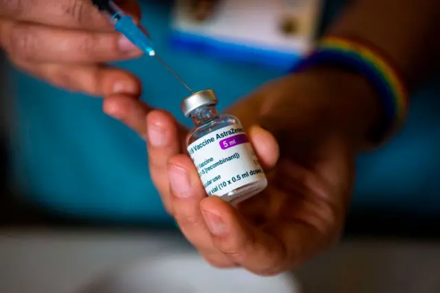 A vaccine dose being prepared at a care home