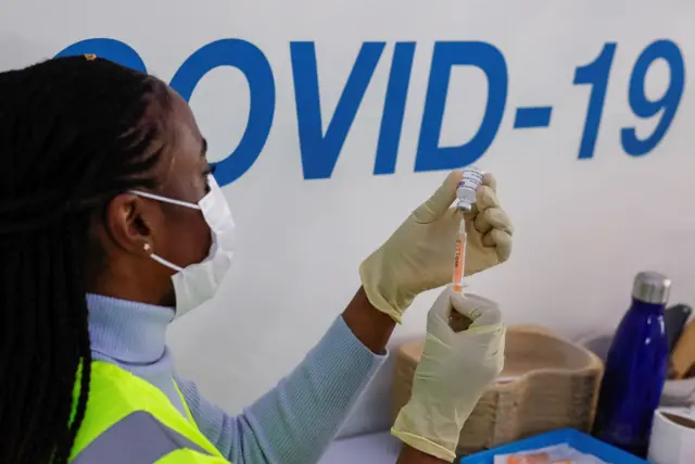 A nurse preparing a vaccine dose in Maidstone, Kent