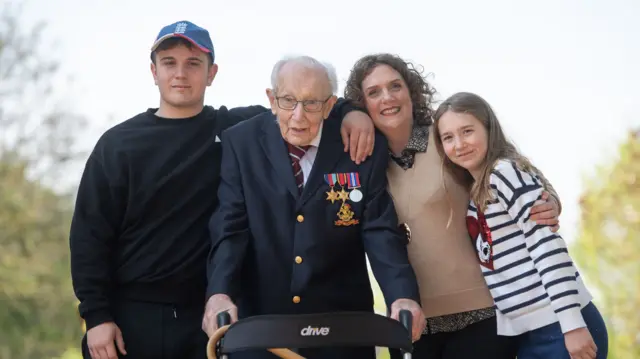 Tom Moore, with (left to right) grandson Benji, daughter Hannah Ingram-Moore and granddaughter Georgia