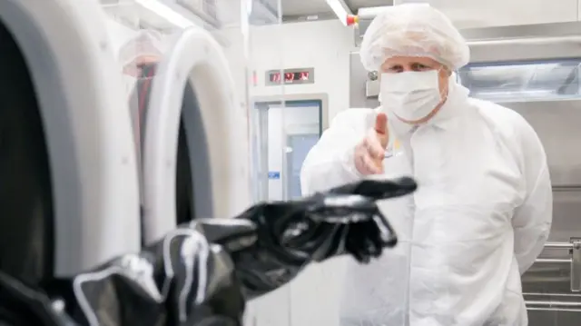 Boris Johnson in a labcoat at AstraZeneca's factory in Macclesfield