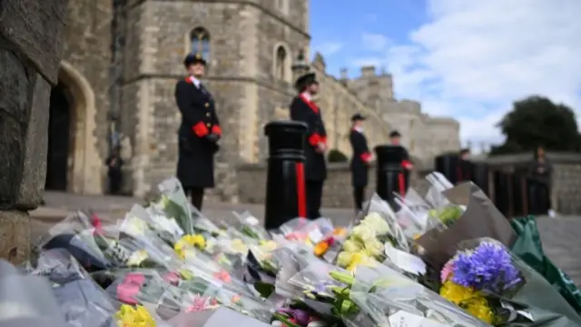 Flowers with condolence messages outside Windsor Castle