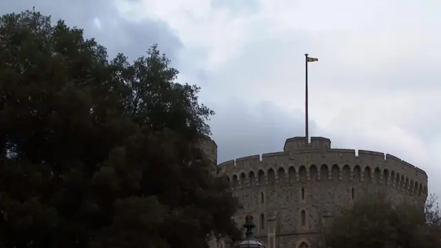 The Royal Standard flies at full-mast above Windsor Castle on Friday evening