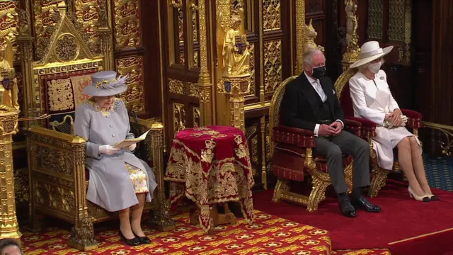 The Queen is accompanied by Prince Charles and the Duchess of Cornwall