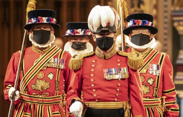 Yeomen of the Guard, the royal bodyguards wearing face masks