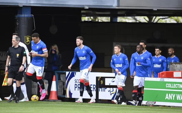 Rangers players enter the pitch