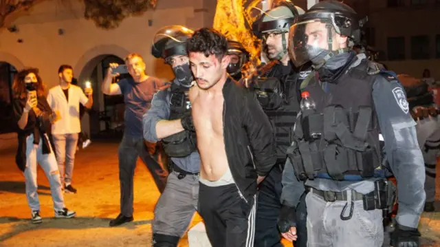 Israeli police disperse a Palestinian protest in Haifa