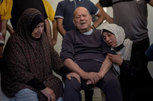 Relatives of Palestinian Abdul Salam Al-Ghazali, who was killed during an israeli raid in Al-Sabra neighborhood, central Gaza City, mourn during his funeral