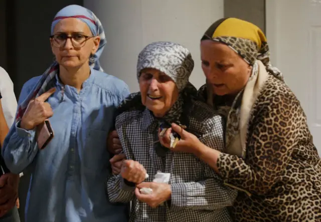 Mourners cry during the funeral of Lea Yom Tov in Rishon LeZion