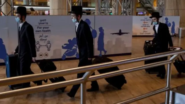 Ultra-Orthodox Jewish men walk at Ben Gurion airport, Israel. File photo