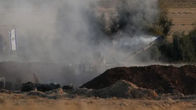 Israeli artillery fires a shell near the border with Gaza