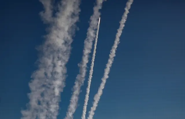 Rockets fired from Gaza fly towards Israel, as seen from Gaza City. Photo: 14 May 2021