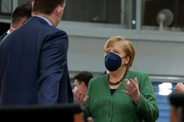 German Health Minister Jens Spahn (L) and German Chancellor Angela Merkel (R) at the beginning of the cabinet meeting in Berlin, Germany, on 12 May 2021