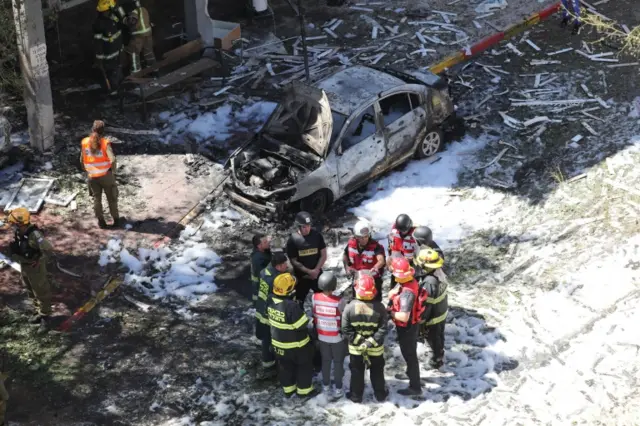 Israeli emergency teams are at the scene where a rocket fired from the Gaza Strip hit in the central city of Ramat Gan near Tel Aviv, Israel, on 15 May 2021