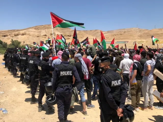 Police are seen during a protest to express solidarity with the Palestinian people, in Karameh, Jordan valley, Jordan, on 15 May 2021