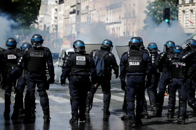 Police officers stand on a street during a protest in support of Palestinians following a flare-up of Israeli-Palestinian violence, in Paris, France, on 15 May 2021