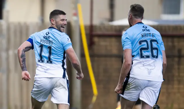 Iain Vigurs celebrates a great goal against his old club